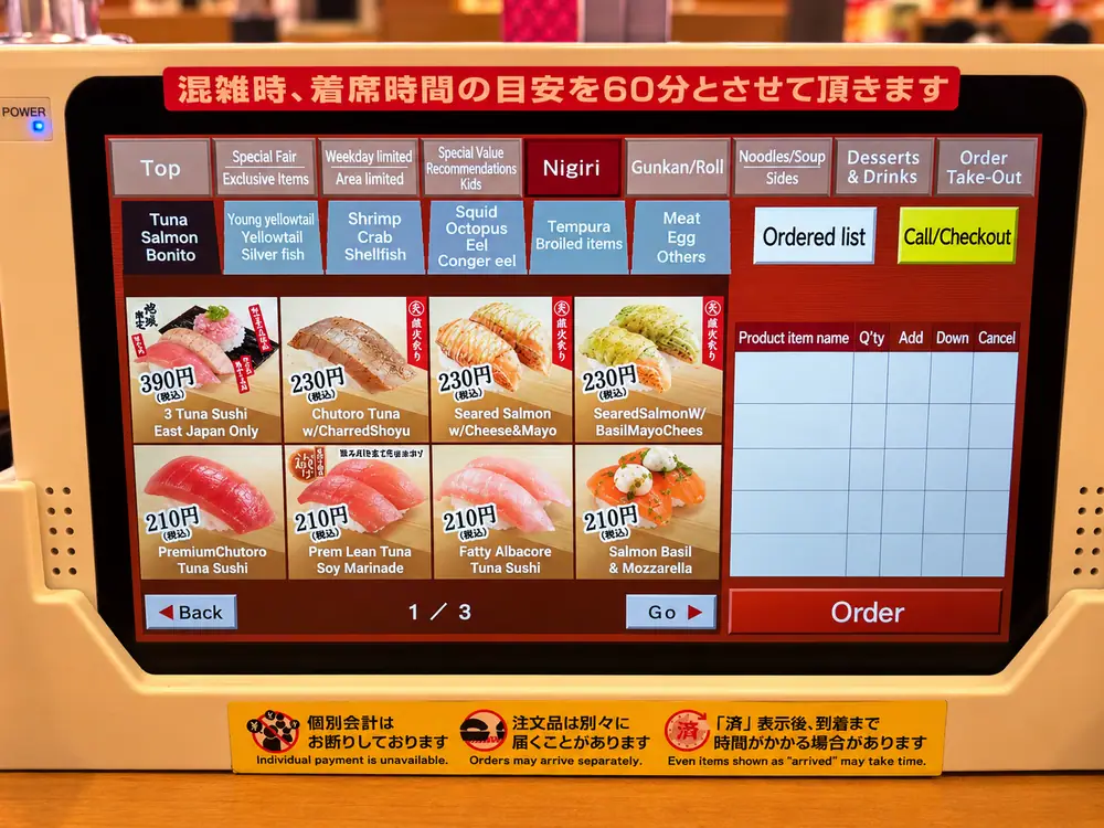 English Sushiro nigiri menu showing sushi photos and prices