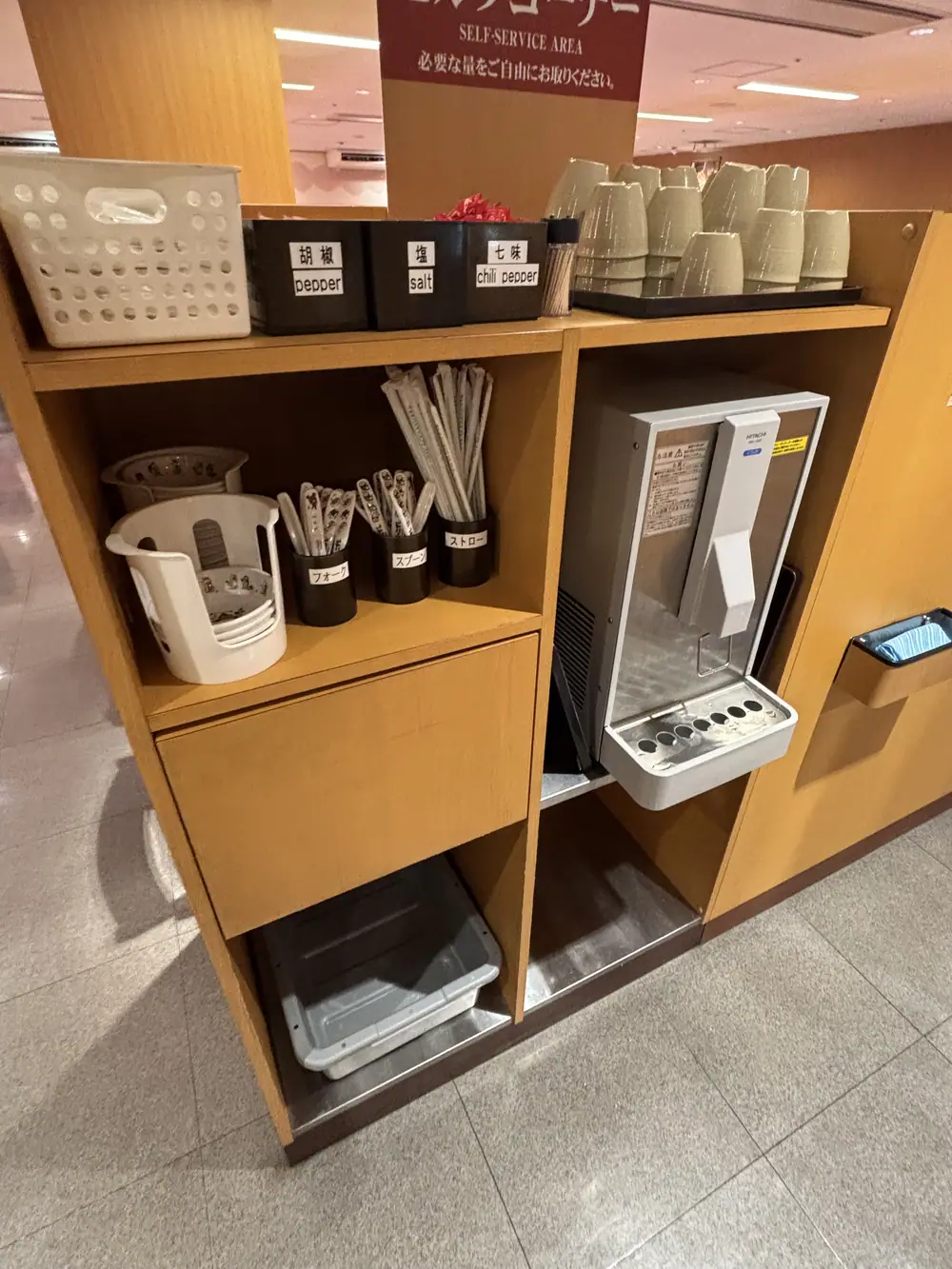 Self-service area at Sushiro for water, wet towels, and children’s dishes