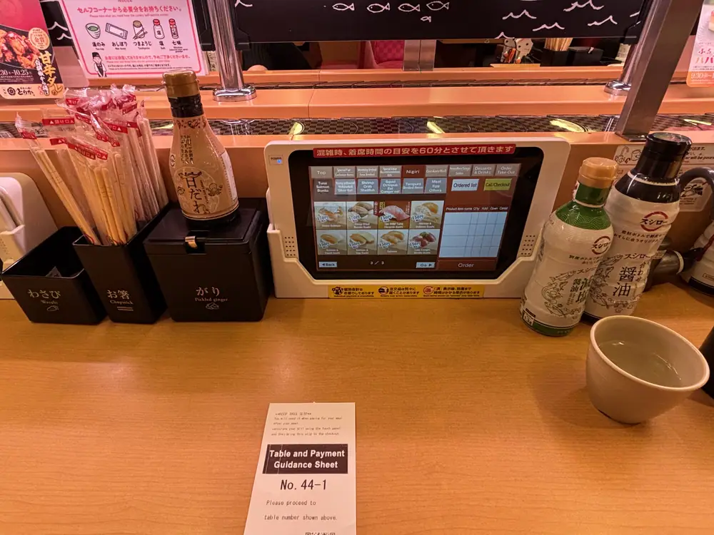 Wasabi, chopsticks and soy sauce available at a Sushiro table