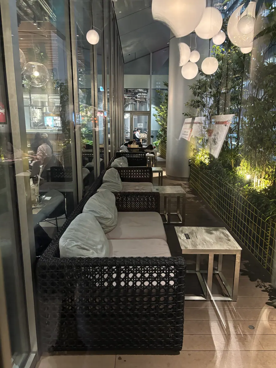 Sofa seating beside plants on the second-floor terrace at Tokyo Midtown Yaesu